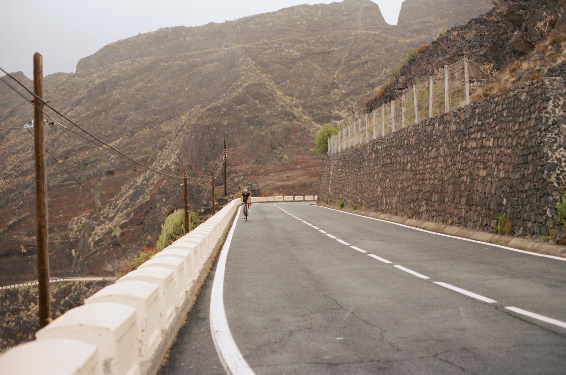 A cyclist goes uphill in Tenerife, Spain